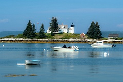 Boats Moored Around Pumpkin Island Light  on a Hazy Day